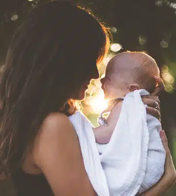 A photo of a mother holding her baby - Donald Winnicott's work describes the ‘good enough mother’ as one who consistently meets the needs of the infant, but does not do so with absolute perfection, allowing space for the infant to develop a sense of themselves as autonomous.