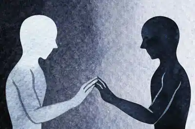 Two persons with their hands touching - The image means to communicate relational depth in counselling, which is used to explain the deep connection between counsellor and client that can be present within a therapeutic relationship.
